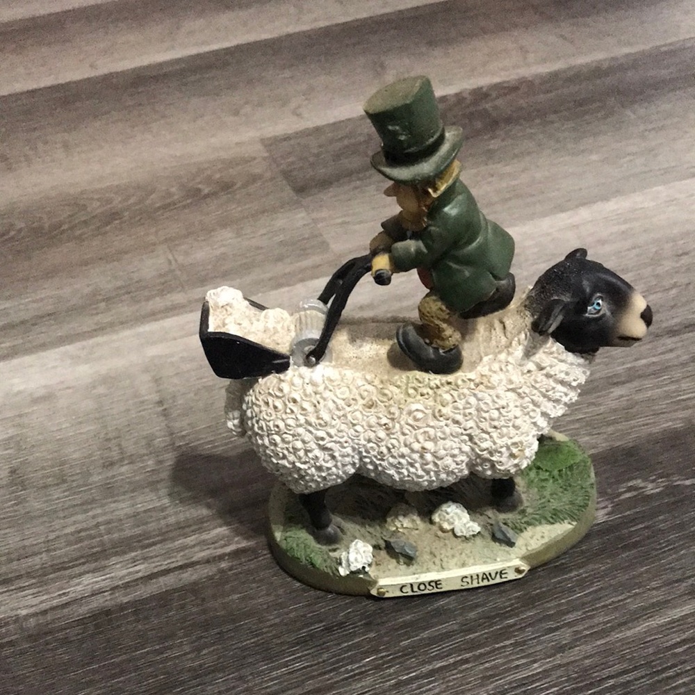 White Sheep Sculpture with Green-Robed Rider Figurine
